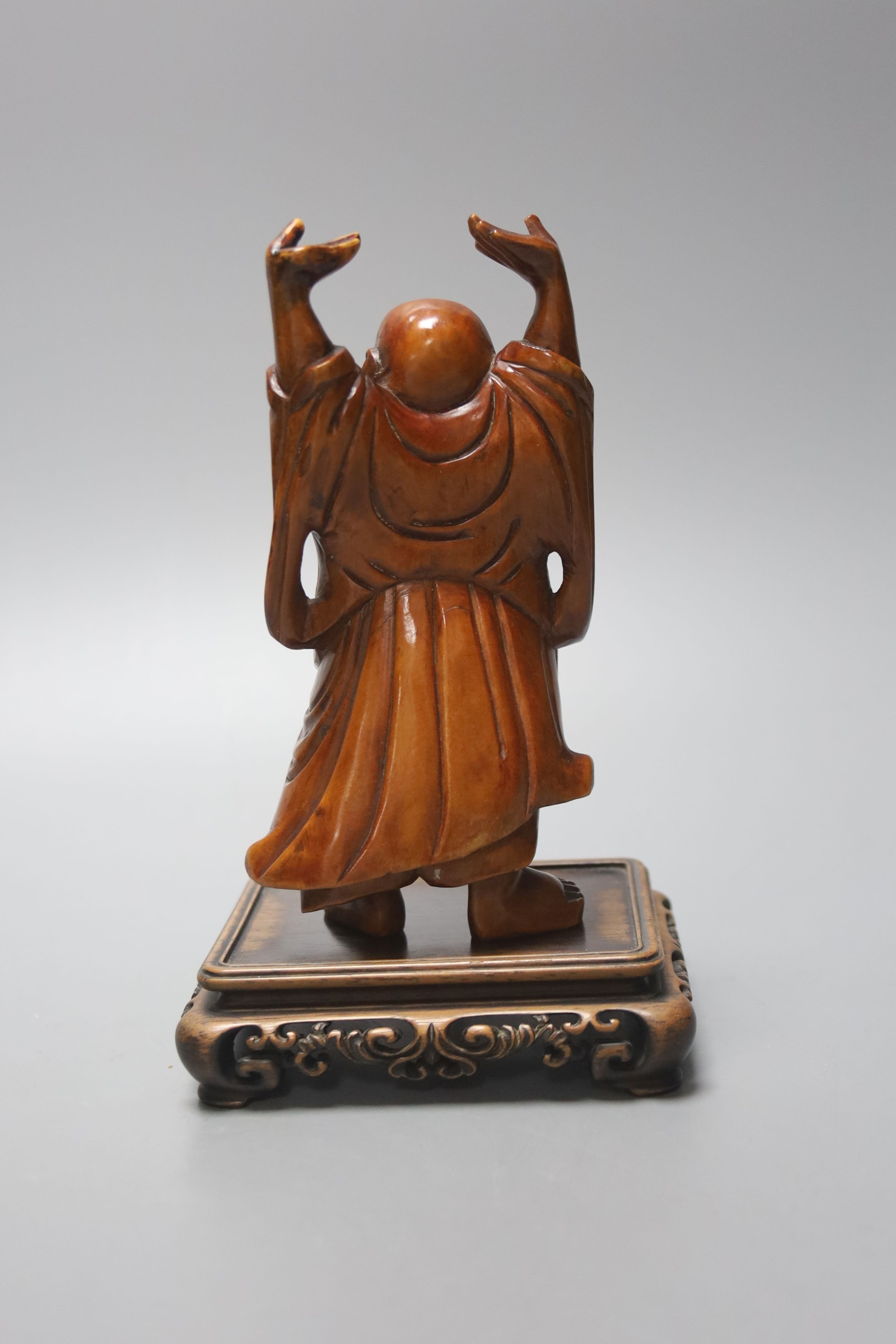 A Chinese boxwood figure of Budai standing, on a hardwood stand 14cm excl stand